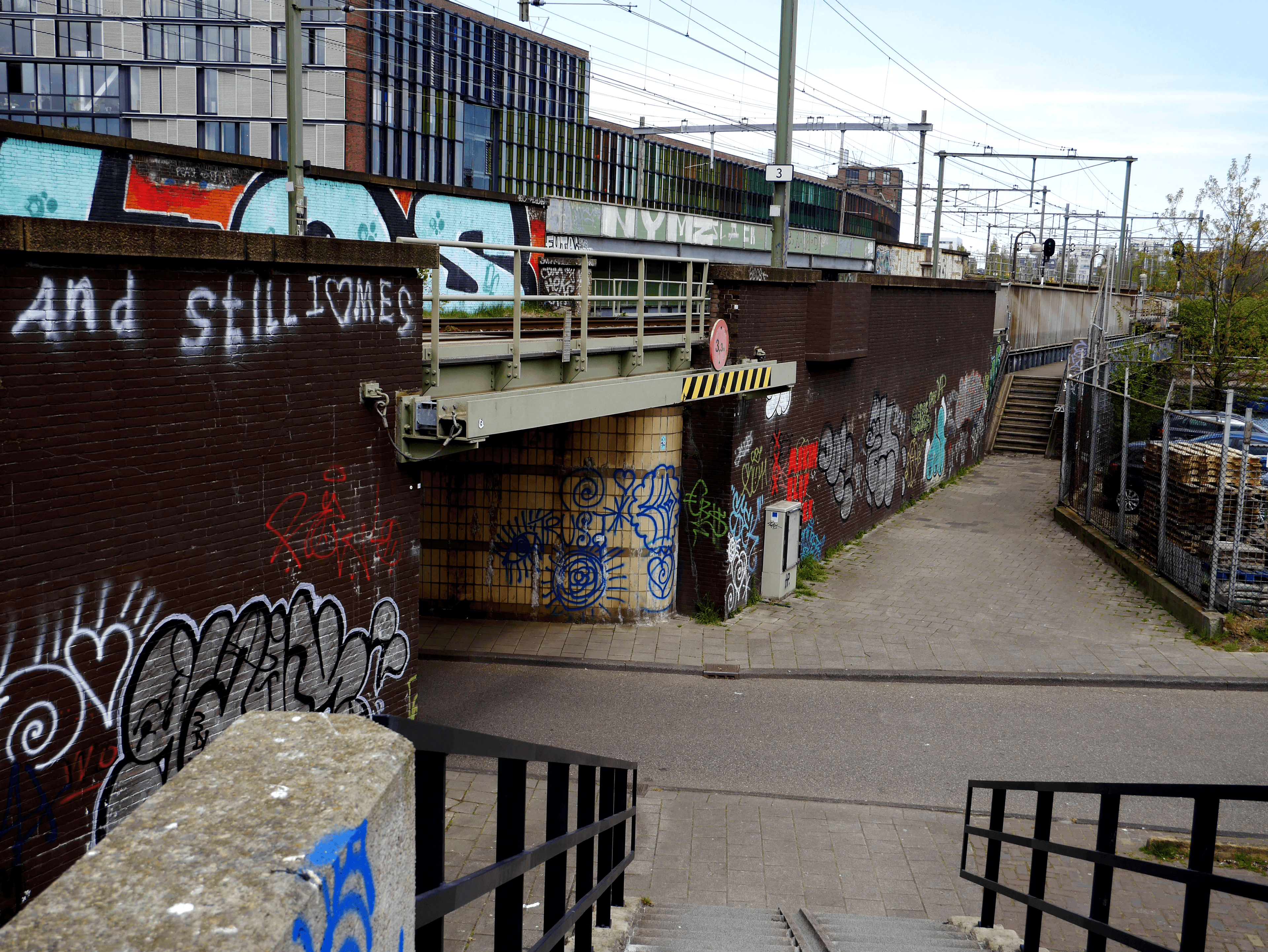 An empty street with a long staircase that is not accessible to wheelchair users
